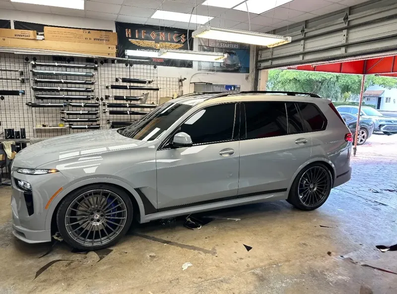 BMW SUV with window tint — side profile